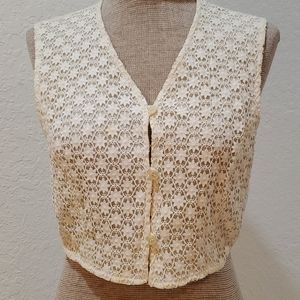 Cream, lace vest blouse, lined with buttons.